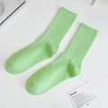Ribbed mid-calf cotton socks in bright lime green color on a minimal background - One Size / Avocado Green
