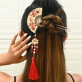 Golden fan-shaped hair pin with red flowers and long tassels for traditional bridal style - Red (Left)