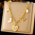 Collana in acciaio inossidabile dorato con ciondoli a cuore e uccello su espositore - Oro (N3212)