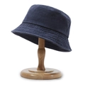 Navy blue washed cotton bucket hat with metal eyelets on a wooden stand - One Size / Navy Blue