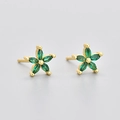 Detailed view of flower studs with green marquise stones in a gold setting - Gold Green Zirconia