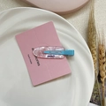 Pink translucent acetate duckbill hair clip with blue peach text on a display card - Pink Shimmer