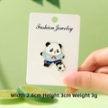 Cute panda sports enamel pin with blue jersey and soccer ball on a green background - School Season Soccer Panda