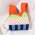 Knitted tote bag with colorful orange, green and blue wave patterns and polka dots - Mountain Range Small Trees Striped Orange
