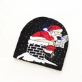 Black Christmas knit hat with LED lights and Santa Claus reading on a chimney - Black Santa Clause