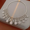 Detailed close-up of zircon flower necklace with pink pear-shaped gemstones on a stand - Water Drop Pendant Necklace / Silver-Pink