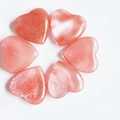 Polished natural pink quartz heart stones showing unique textures in 2cm size - Watermelon Red (Synthetic)