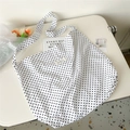 Detail of canvas tote bag showing black polka dots and woven brand label on white surface - 11D White Polka Dot