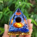 Orgonite pyramid with blue stones, gold flakes, and black sphere over red mandala - 5cm / A10-Blue Stone Black Ball Red Totem
