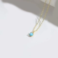 Gold pendant necklace featuring a round turquoise blue stone with minimalist O-chain link - Sky Blue (Gold Chain)
