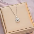 Silver titanium clover necklace with radiating baguette zircons in a golden gift box - 6060 Circle Clover / Silver