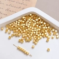 Detail of 14k gold plated cube spacer beads on a needle for DIY jewelry making - 3mm 18k Gold (10 Pcs)