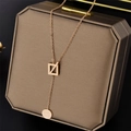 Rose gold Y-shaped titanium necklace with square pendant and Good Luck round charm - Rose Gold