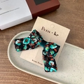 Floral fabric bow hair clip with dark green velvet center on a textured card - Single Bow Style / Green Bow Hair Clip