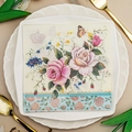 Floral party napkin with rose, butterfly and crown print on a set dining table - Retro Rose Butterfly Crown (1016)