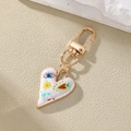 Bunter Herz Schlüsselanhänger mit Blumenprint und Goldplattierung auf strukturiertem Stein - Graffiti Träne Stil (1#)