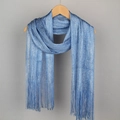 Light blue shimmering scarf with fringe trim, displayed on a wooden hanger - Denim Blue Silver