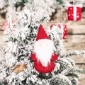 Christmas gnome plush doll with red sequin hat and white beard hanging on pine tree - Red