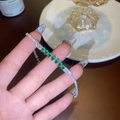 Silver plated bracelet featuring nine green oval zircons and detailed pavé diamond accents - Silver Green Diamond Bracelet (GA3130)