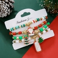 Detailed view of 4-piece Christmas bracelet set with Santa and tree charms on a festive card - SY0670-Santa and Tree 4PCS Set