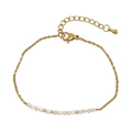 Elegant gold chain bracelet featuring white semiprecious beads and lobster clasp - White