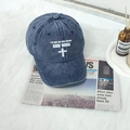 Washed denim blue baseball cap with white cross and God Wins print on newspaper - One Size / Navy Blue
