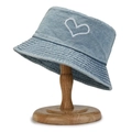 Light blue denim bucket hat featuring white heart embroidery on a wooden stand - Heart Embroidery Light Blue