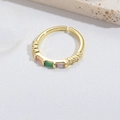 Adjustable gold ring featuring rectangular pink, green, and purple gemstones and small diamonds - Square Green Zirconia Style