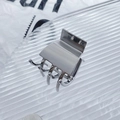 Silver square metal hair claw clip with a polished finish on a textured glass surface - High Ponytail Claw Clip / Silver