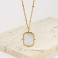 Vintage gold titanium steel necklace with rectangular white shell pendant on travertine - Gold Square Shell Pendant Necklace