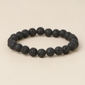 Macro detail of natural black lava stone beads showing porous volcanic texture - Lava Stone / 10mm