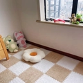 Brown and white checkerboard plush interlocking floor mats in a cozy bedroom setting - Beige & White