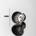 Detail of a 1.03cm mens stainless steel sun skull stud earring with black enamel finish - Sun Face Style (S268)