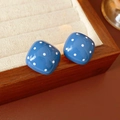 Detail of square blue earrings with white polka dots on a wooden display tray - Blue (Silver Earring Post)