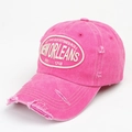Close-up of pink distressed baseball cap featuring vintage New Orleans letter embroidery - Adjustable / Rose Red