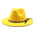 Macro detail of the bright yellow fedora featuring a gold chain and black leather bow - M (56-58cm) / Yellow