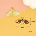 Detailed view of 28mm butterfly charms with brown enamel and gold plating for DIY crafts - Brown