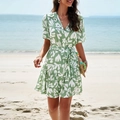 Elegant green short sleeve dress with white leaf print and a flattering waist tie detail - S / Green