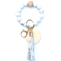 Detail of marble pattern silicone beads with hexagonal wood bead and gold keyring - Marble