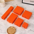 Set of 6 orange drawer jewelry boxes with silk ribbon handles on marble background - Orange; 9*9*3.2cm
