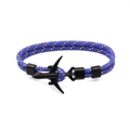 Detail of blue braided parachute cord bracelet with a black airplane charm and buckle - Black Airplane Buckle / Blue Camouflage