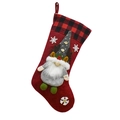 Detail of Christmas stocking featuring Santa Claus 3D doll and red plaid cuff - Red