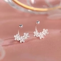 Silver petal stud earrings with creamy white enamel finish on pink satin background - Glazed Petal Style (A130)