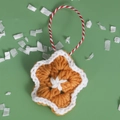Handmade brown and white crocheted star ornament with festive hanging rope and yarn texture - Snowflake