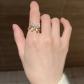 Gold butterfly ring with transparent zircon wings and textured metal finish on finger - Butterfly Square Diamond