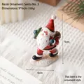 Resin Santa Claus figurine with red bag on snow base, Christmas tabletop ornament 9x6cm - Santa Style 3