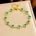 Golden stainless steel bracelet with blue faceted crystal heart charms and adjustable chain - Lake Blue Heart (B1665)