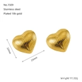 Macro detail of heart earrings in 18K gold plated stainless steel with vertical textures - Heart Striped Style (1509)