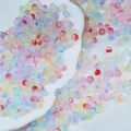 Mix of colorful frosted glass beads for DIY jewelry making on white silk and ceramic - Two-tone Beads Mixed Colors (6mm)