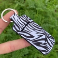 Lipstick keychain holder with classic zebra print pattern and silver metal ring - Black and White Zebra Stone